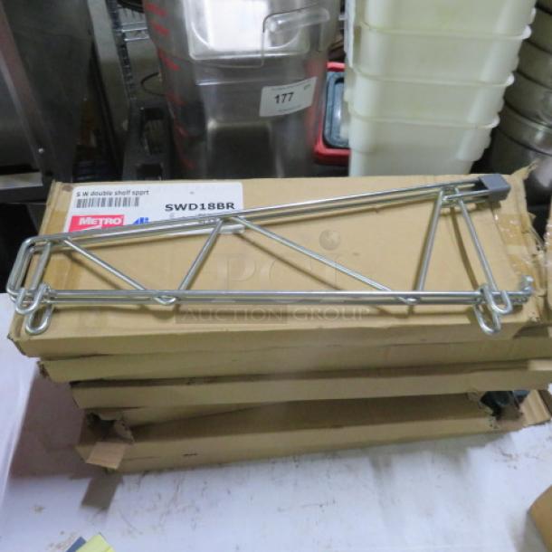 New Metro wall mount shelf bracket, SWD18BR model, metal construction, in original packaging with visible label.