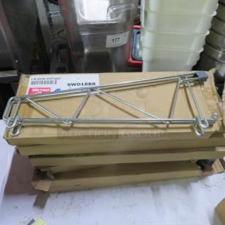 New Metro wall mount shelf bracket, SWD18BR model, metal construction, in original packaging with visible label.