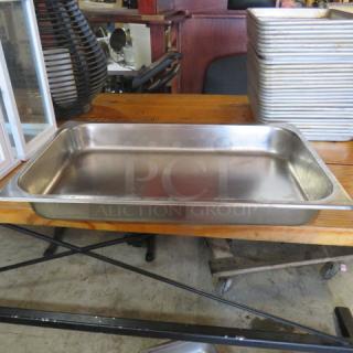 Stainless steel full-size hotel pan, 2.5 inches deep. Used condition. Suitable for catering and restaurant use.
