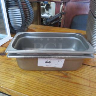 Stainless steel 1/3 size, 4-inch deep hotel pan, new condition, with auction label "44" visible on the side.