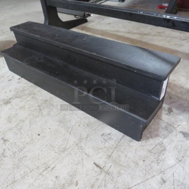 Two-tier wooden bottle display, 34x9x9 inches, black finish, used condition, ideal for showcasing bottles.
