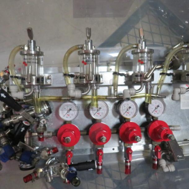 Micromatic beer tap handles, regulators, and gauges set. Includes multiple taps with clear hoses and pressure gauges. Excellent condition.