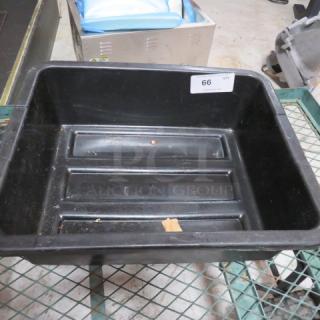 Black plastic bussing tub with ribbed interior; moderate wear. Label marked "66" indicates item number.