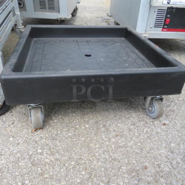 Cambro Dish Rack Dolly CD2020, black, with four swivel casters, used condition, suitable for commercial use.