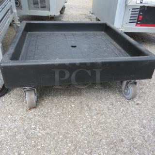 Cambro Dish Rack Dolly CD2020, black, with four swivel casters, used condition, suitable for commercial use.
