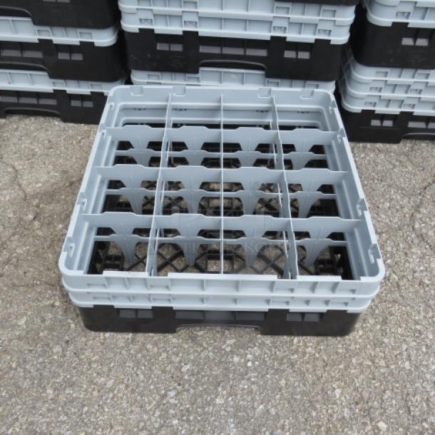 Cambro 16 Hole Dishwasher Rack, durable plastic, gray and black, excellent condition, stackable design for easy storage.