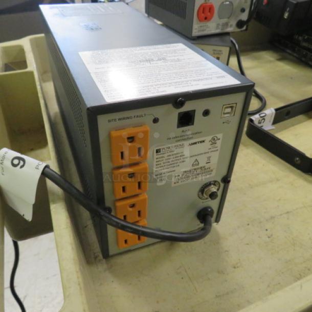 Powervar Battery Back Up, model ABCEG25-11, features multiple outlets, visible labels, in used condition.