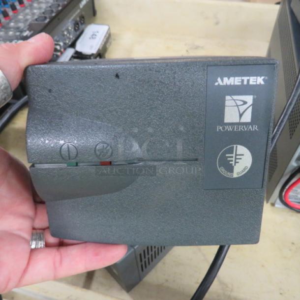Ametek Powervar 1.5 Battery Backup, model #ABC150-11, in used condition. Features power indicators and brand logo.