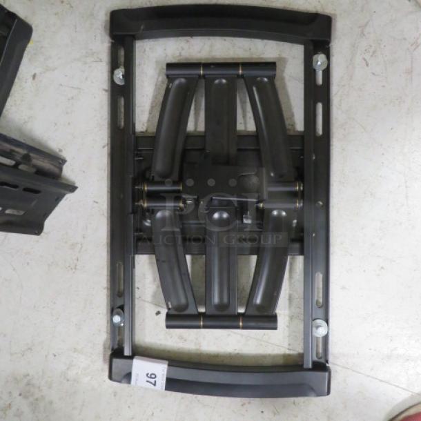 Heavy-duty TV wall mount, black metal, adjustable arms, excellent condition, includes mounting hardware.