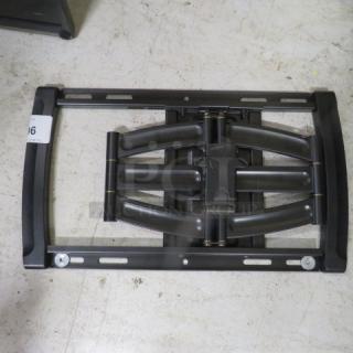 Adjustable black TV wall mount, metal construction, pristine condition, includes mounting brackets and screws.