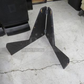 Black wooden holder, foldable design, with visible wear on edges. Ideal for displaying items, sturdy construction.