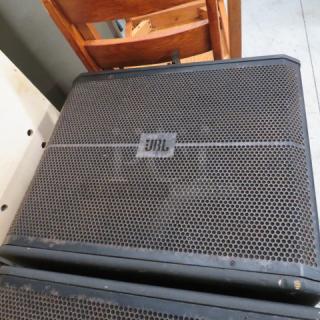 JBL VRX900 speaker, black with front grille, visible JBL logo. Moderate wear, suitable for professional audio use.