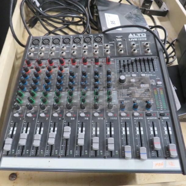 Alto Professional Live 1202 Mixer, 12-channel, various controls and inputs, used condition, model 1202 visible on panel.