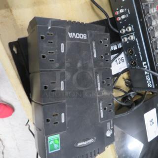 Cyber Power 500VA UPS, multiple outlets visible, black, moderate wear, suitable for protecting electronic devices.