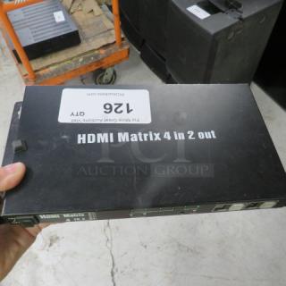 HDMI Matrix 4 In 2 Out in good condition, black casing, visible model label. Features input/output ports for multiple displays.