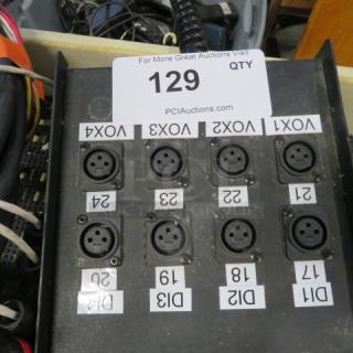 Audio connection panel with multiple XLR input/output ports labeled VOX1 to VOX4, DI1 to DI4. Auction tag number 129.
