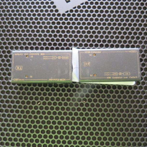 HDMI Extender pair, includes transmitter and receiver units, black casing, labeled for HDMI over Cat5e/6 cables.