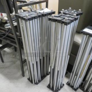 Foldable stage base, silver metal rods, black plastic connectors, sturdy design, model 4XBID, good condition.