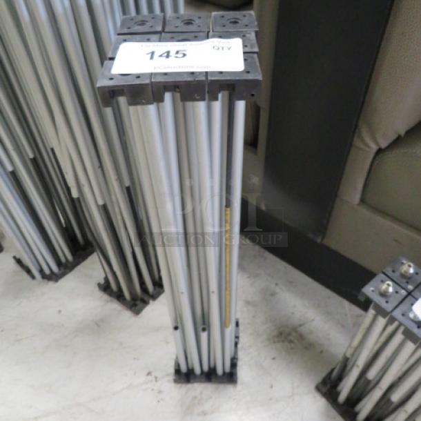 Foldable stage base with metal frame, lot number 145 label visible. Compact design for easy storage and transport.