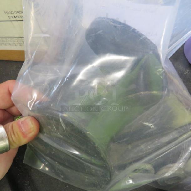 Foot Levelers 3XBID in plastic bag, green color, slight wear visible. Used condition, held by hand, with boxed background.