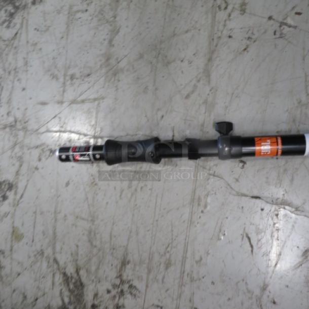 JBL Professional JBLPOLE-GA telescoping speaker pole, auto-raising feature, black with adjustment knob, price tag visible.