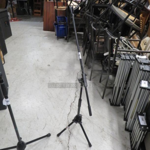 DR Pro mic stand in good condition, adjustable height, sturdy tripod base, suitable for studio or stage use.