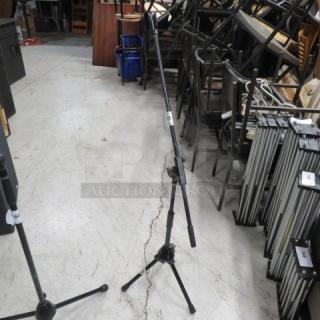 One Pro Line mic stand, black, adjustable height with tripod base, in good condition. Ideal for studio or live performance.