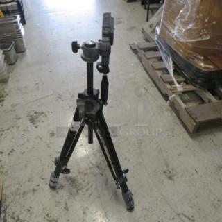 SIIK Stand #88N, sturdy tripod with adjustable height, black finish, in used condition with minor wear.