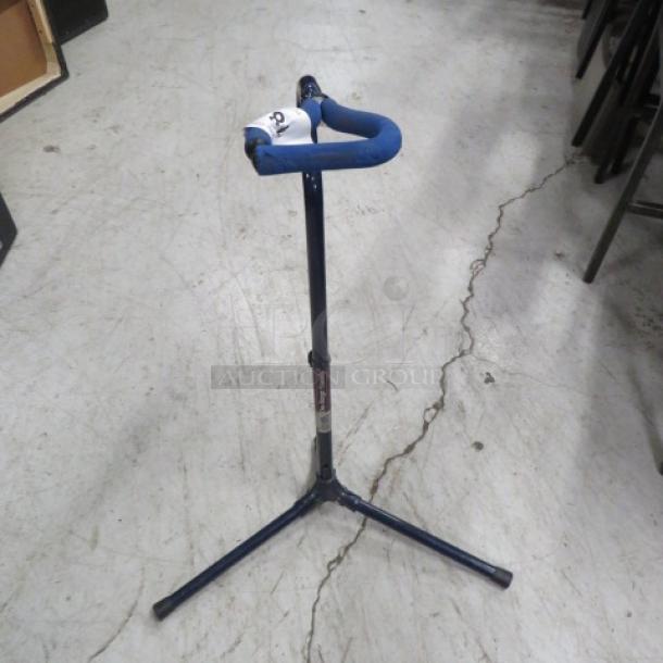 One On STAGE stand, blue, tripod base, adjustable height, sturdy condition, label indicating model and manufacturer details.