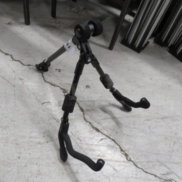 Pro Line stand, adjustable tripod with rubber feet, used condition. Suitable for music instruments or equipment support.