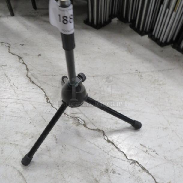 Adjustable instrument stand with tripod base, black finish, labeled with "186" tag. Good condition.
