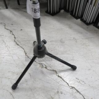 Adjustable instrument stand with tripod base, black finish, labeled with "186" tag. Good condition.