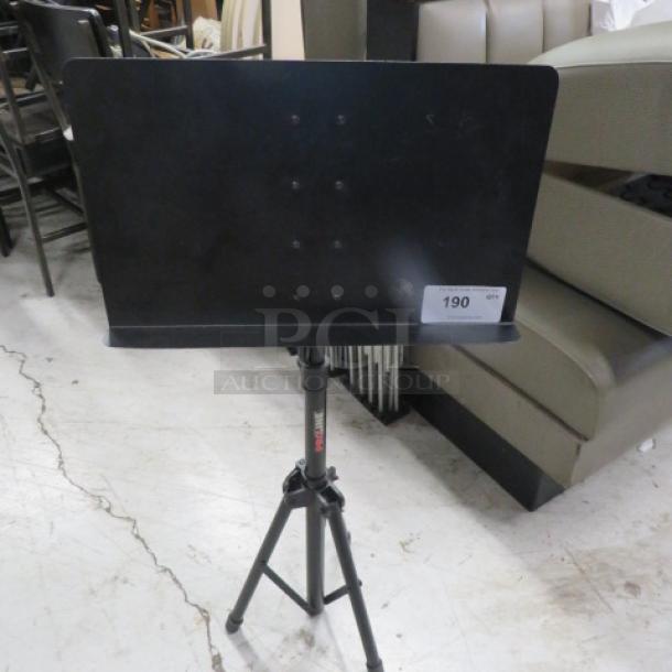 Pro Line music stand, black, model #GC187416, adjustable height, sturdy tripod base, excellent condition.