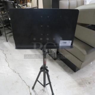 Pro Line music stand, black, model #GC187416, adjustable height, sturdy tripod base, excellent condition.
