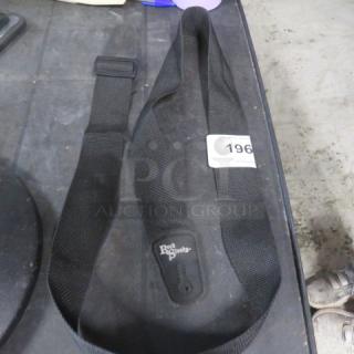 Black Rock Steady guitar strap, adjustable nylon with logo. Good condition. Auction tag marked "196."