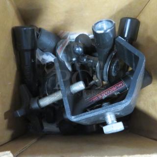 Box of assorted hardware components, including clamps and screws. Some items marked "MUSICIAN'S GEAR." Mixed condition.