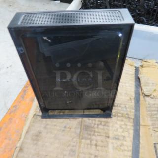 Netgear N300 Wireless Router, black, upright position, minor surface wear, visible logo on front panel.