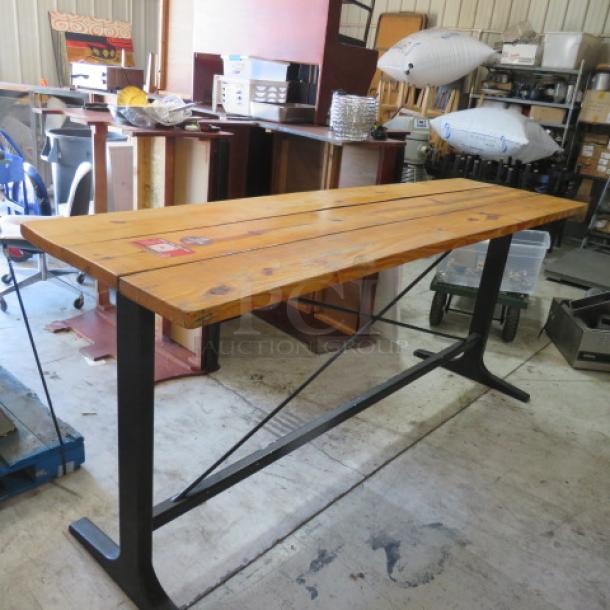 Solid wood bar height table with black metal industrial base, dimensions 96x28x42 inches. Excellent condition.