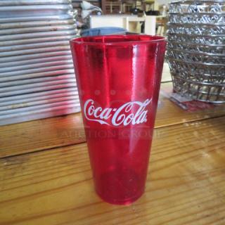 Red 24oz Coca Cola tumbler with logo, new condition. Part of a case of 24.