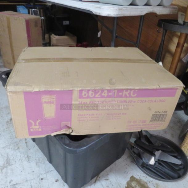 Case of 24 new 24oz Coca Cola tumblers in original packaging. Box labeled "6624-1-RC" and "Red Textured Tumbler w/ Coca-Cola Logo."