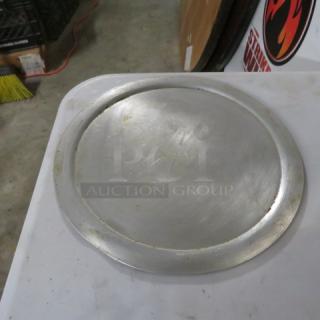 14-inch pizza pan, metal, used condition with surface scratches and wear. Model 9XBID. Perfect for baking pizzas.