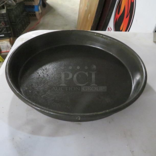 10-inch deep dish pizza pan, model 10XBID, used condition with visible wear, no visible labels or markings.