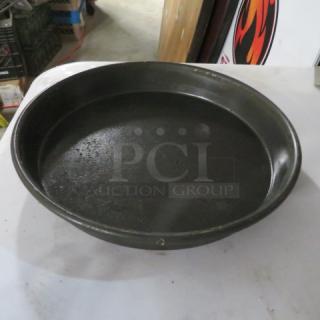 10-inch deep dish pizza pan in used condition, model 10XBID, with visible wear, ideal for baking thick-crust pizzas.