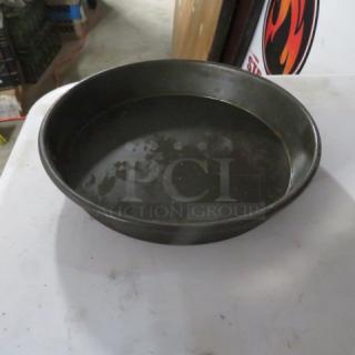8-inch deep dish pizza pan, used condition, dark finish, visible wear marks indicating previous use. Model: 10XBID.