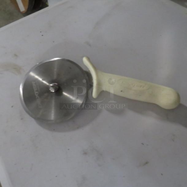 Dexter Pizza Cutter, model 2XBID, stainless steel blade, white ergonomic handle, used condition.