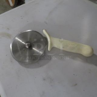 Dexter Pizza Cutter, model 2XBID, stainless steel blade, white ergonomic handle, used condition.