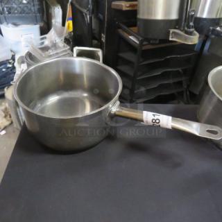 Winco 9X5 stainless steel sauce pan, sturdy handle, good condition, auction tag labeled "281," ideal for kitchen use.
