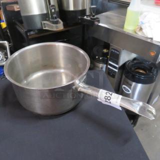 Winco 9x5 stainless steel sauce pan, gently used, sturdy handle, auction tag visible, ideal for professional kitchens.