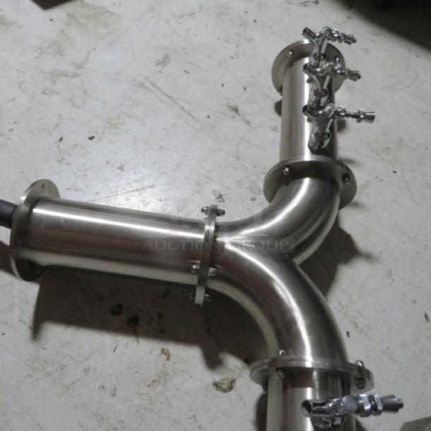 Stainless steel keg tower with 6 taps, industrial design, never installed, pristine condition, Y-shaped configuration.