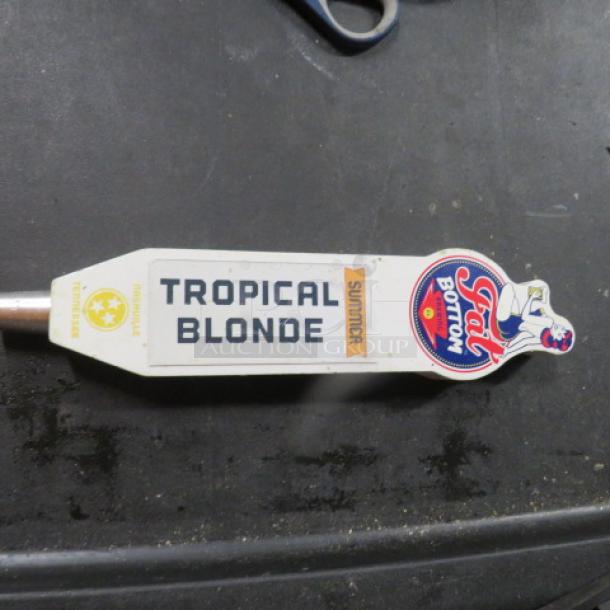 "Got Bottom Tropical Blonde beer tap handle, white with colorful logo and 'Summer' label, in good condition."